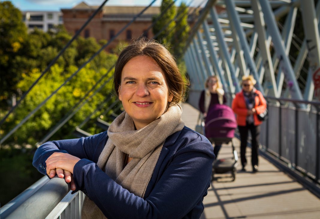 Walking commissioner Petra Jens on a bridge